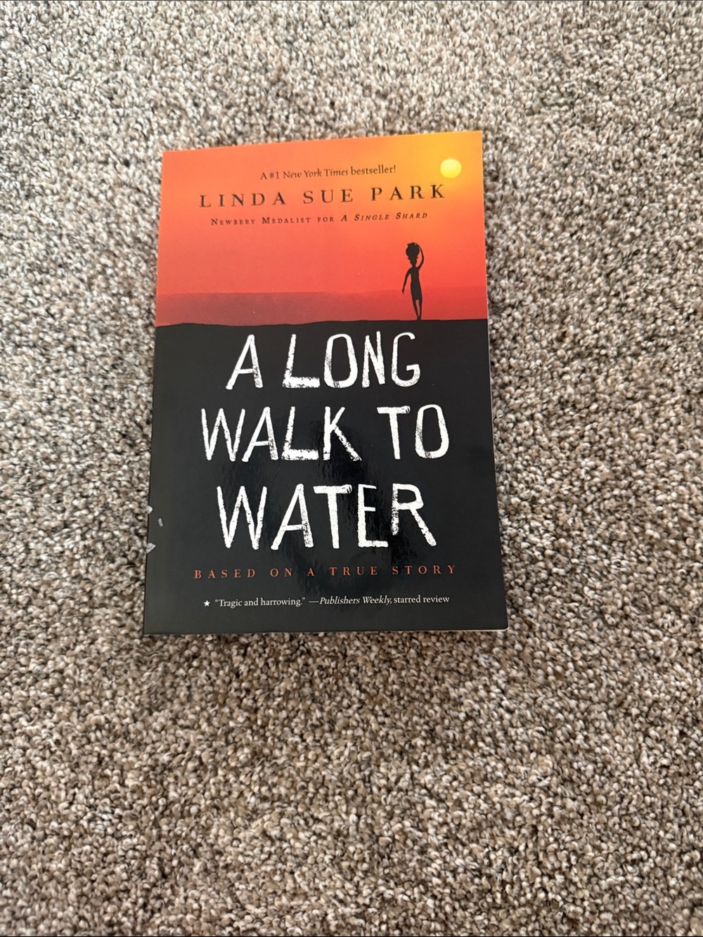 Orange and Black 'A Long Walk to Water' paperback book
